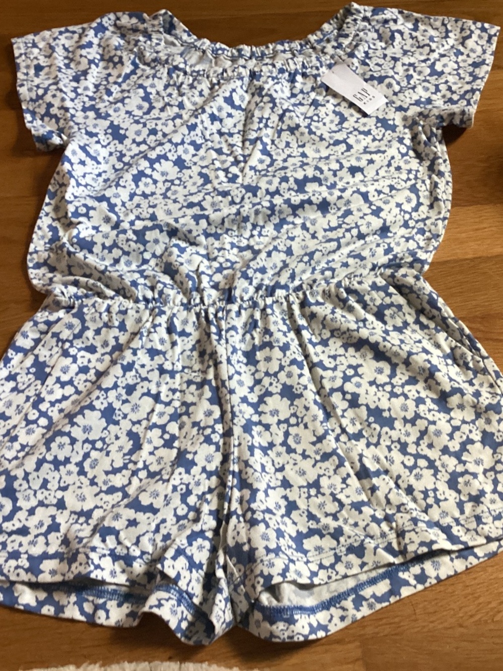 A blue and white floral Gap Kids romper size 6-7